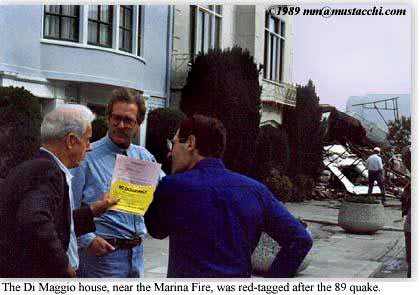 Joe Di Maggio holds No Occupancy posting for his quake-damaged home in the Marina District, near the Marina Fire.