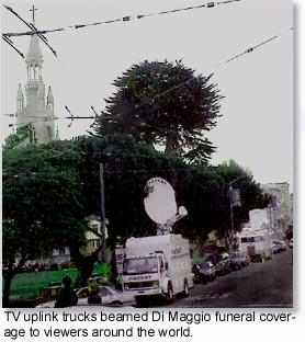 TV uplink trucks at Washington Square park beamed coverage of  Joe Di Maggio's funeral procession to the world.
